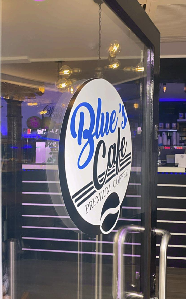 Blue's Café Premium Coffee logo on glass door